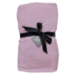 A pink fitted cot sheet with a black ribbon bow on top, displayed against a white background.