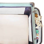 Fitted white cot sheet in a cot