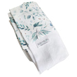 Ruby Melon Cover for Baby Change Mat with watercolour eucalyptus plant pattern in greens