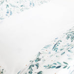 Ruby Melon Cover for Baby Change Mat with watercolour eucalyptus plant pattern in greens