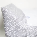 Ruby Melon Cover for Baby Change Mat with white leaf pattern on grey