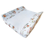 Ruby Melon Cover for Baby Change Mat with woodland theme pattern in subtle brown and green colours