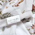 Ruby Melon Cover for Baby Change Mat with woodland theme in subtle brown and green colours