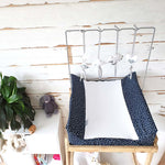 A set of four handcrafted dingle dangle toys in grey and white them: a bunny, heart, lamb, and cloud. Made from soft felt with ribbons, designed for infant sensory development.