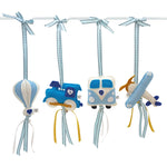A set of four handcrafted dingle dangle toys in transport theme in blues: a train, hot air ballon, volksie, and plane. Made from soft felt with ribbons, designed for infant sensory development.