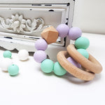 Ruby Melon Silicone Rattle Teether