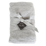 Image of a grey melange baby cot sheet rolled up and wrapped with grey ribbon on a pure white background
