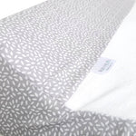Ruby Melon Cover for Baby Change Mat with white leaf pattern on grey