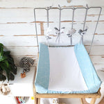 A set of four handcrafted dingle dangle toys in a meadow animal theme in grey and whit: a bunny, bird, lamb, and butterfly. Made from soft felt with ribbons, designed for infant sensory development.